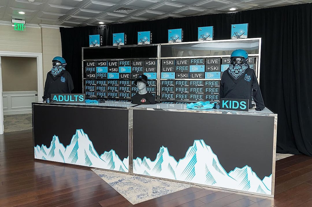 Merchandise counter with mountain graphics and branded apparel