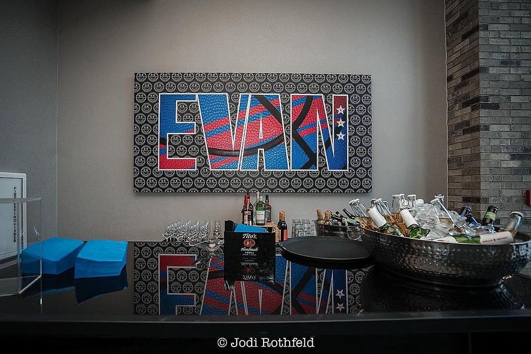 Bar with a custom name graphic and iced drinks
