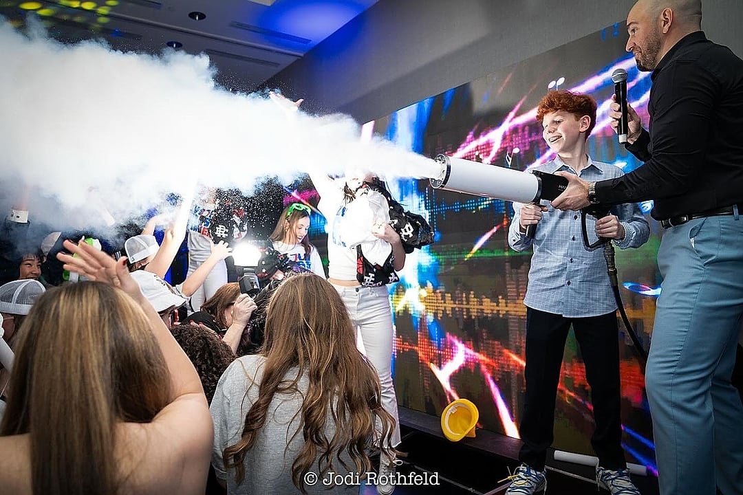 Party performer with a CO2 cannon on the dance floor