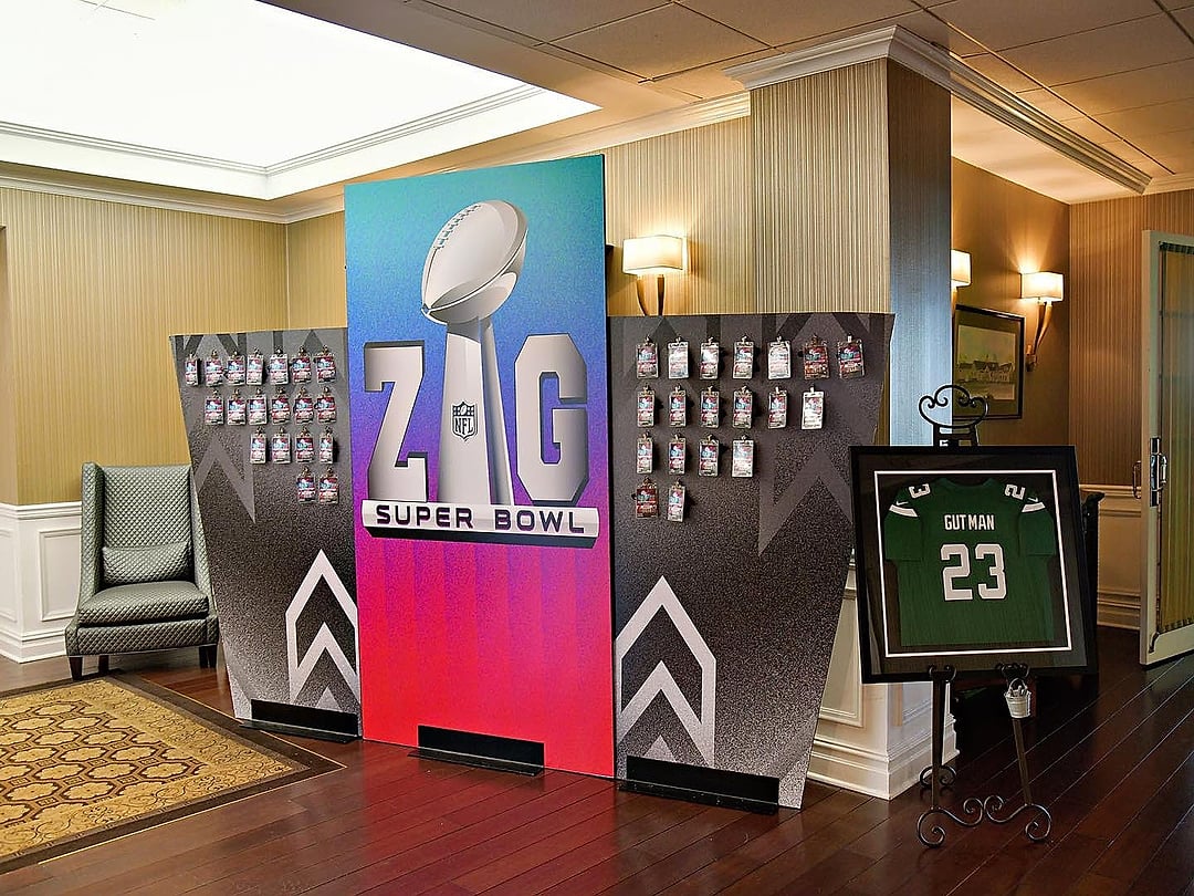 Football-themed photo wall with a framed jersey