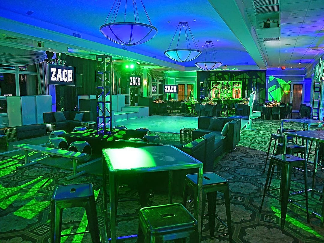 Lounge glowing in green with a football-field carpet