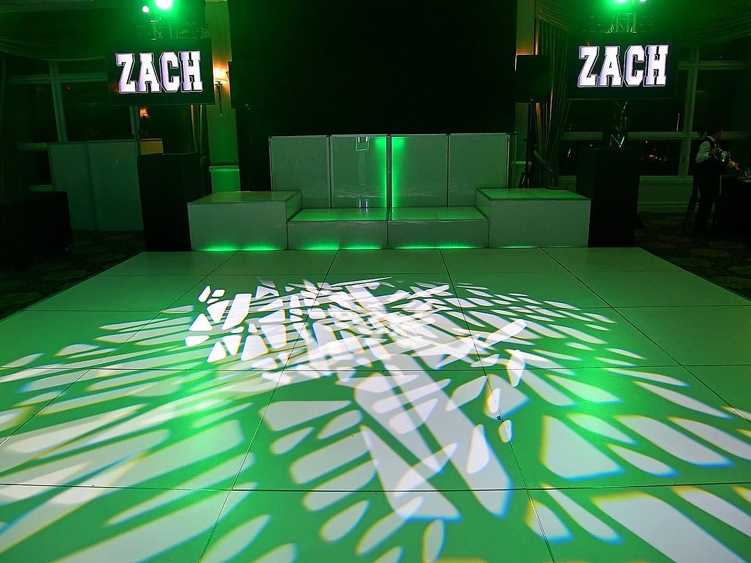 White dance floor patterned with green light